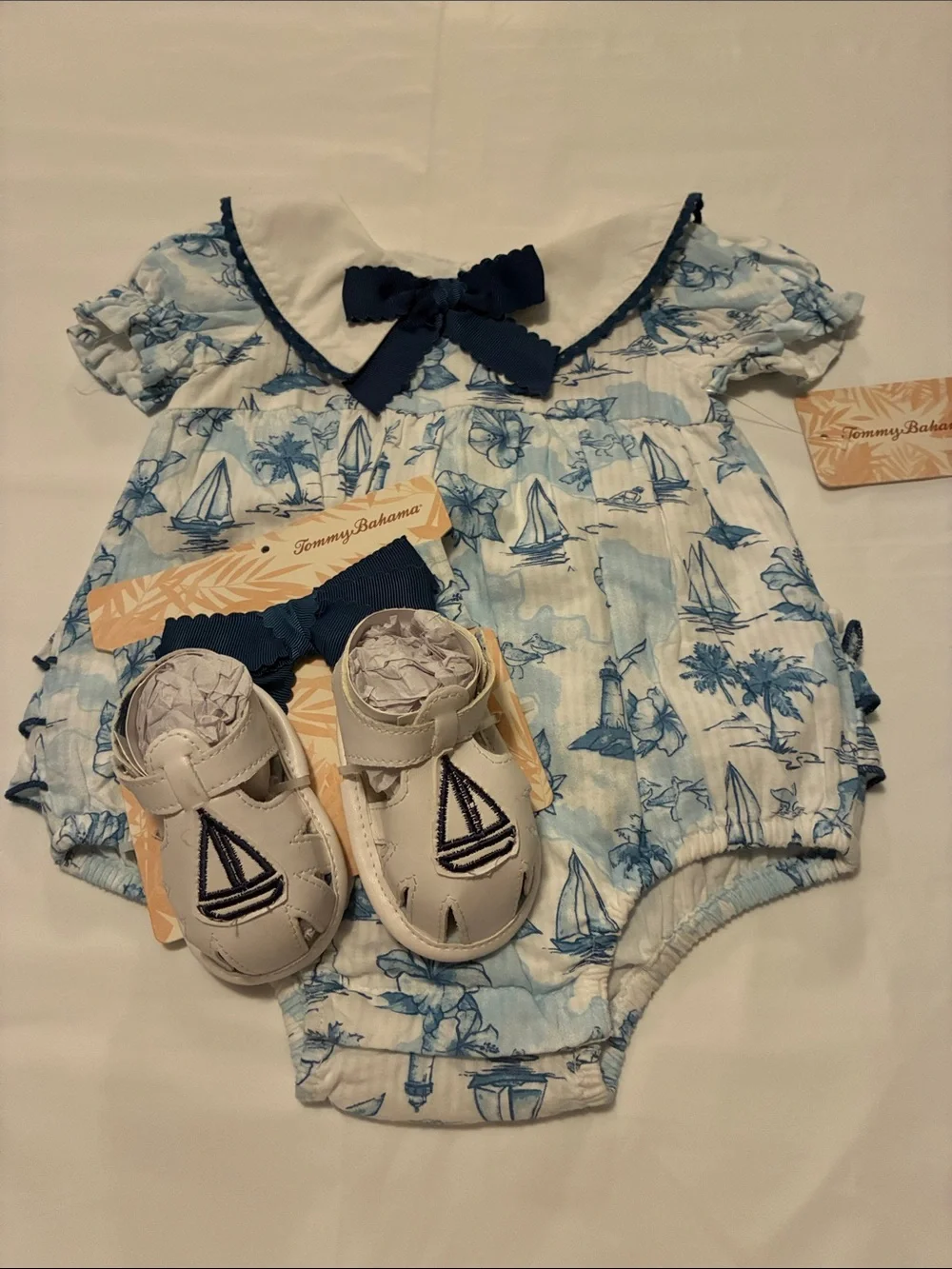 Tommy Bahama Blue & White Sailboat Print Infant One-Piece with Navy Bow - Picture 1 of 6